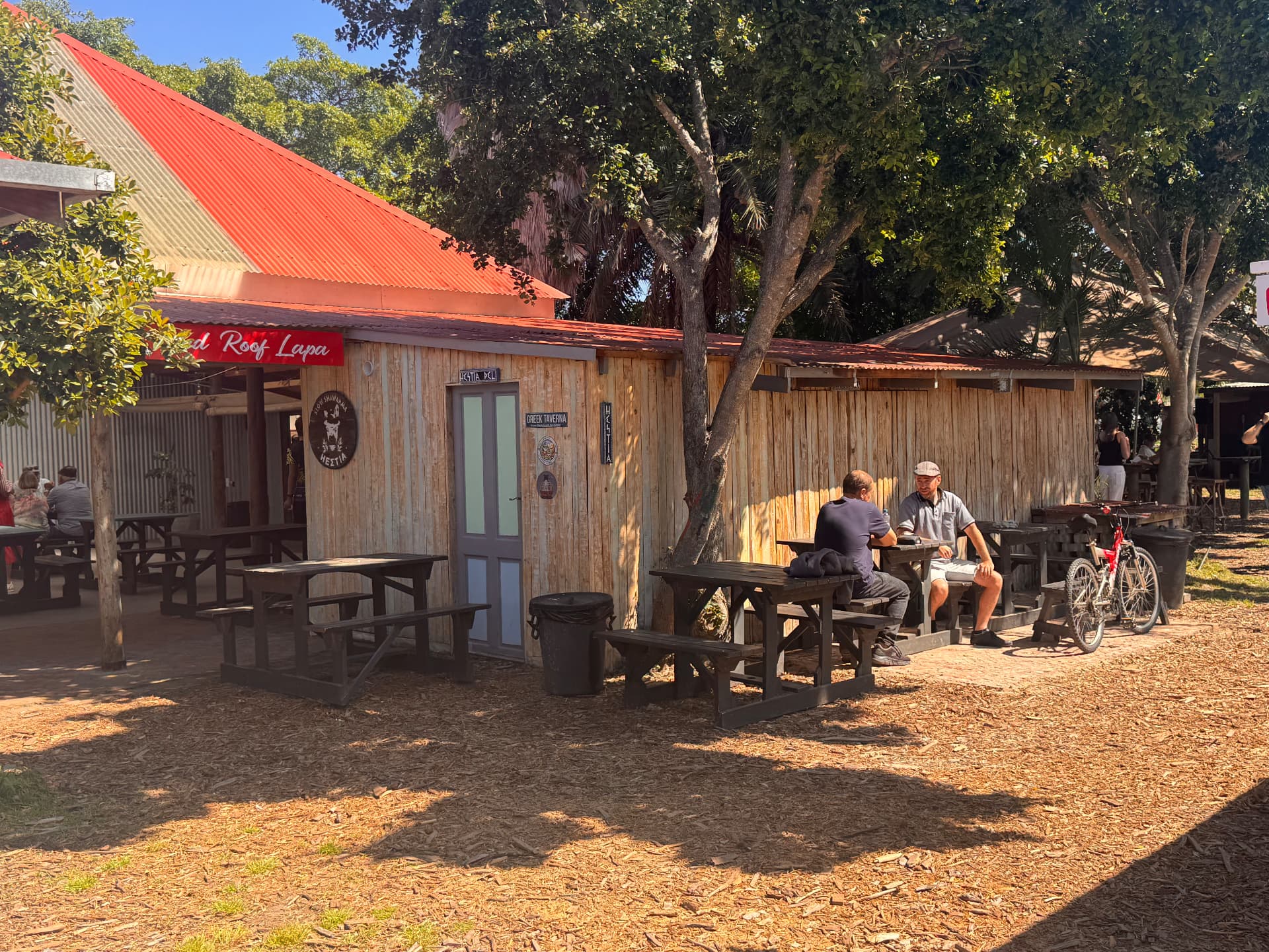 Red Roof Lapa in Sedgefield — the new home of Hestia Deli, an open-air lapa with a red roof and shaded picnic tables